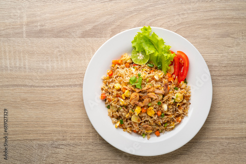 Fried Rice with canned Tuna fish.Quick and Easy Thai style spicy one dish meal on white plate.Top view