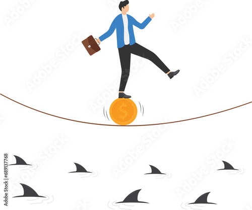 Financial and business risk. stability or balance of economics and investment or risk for losing job concept, businessman balancing not to fail from walking on golden coin and rope.

