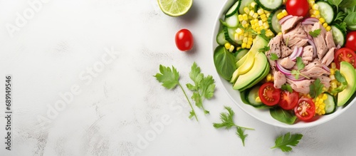 Healthy ketogenic dish Avocado and tuna salad with fresh vegetables Copy space image Place for adding text or design © vxnaghiyev
