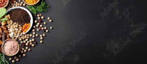Natural ingredients and pet food arranged on a grey table in a flat layout Copy space image Place for adding text or design photo