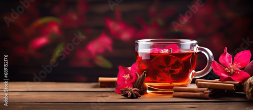 Hibiscus tea with apple and cinnamon on wooden table Copy space image Place for adding text or design photo