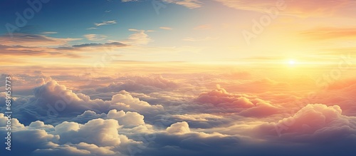 Aircraft viewpoint above clouds displaying breathtaking sunset Copy space image Place for adding text or design photo