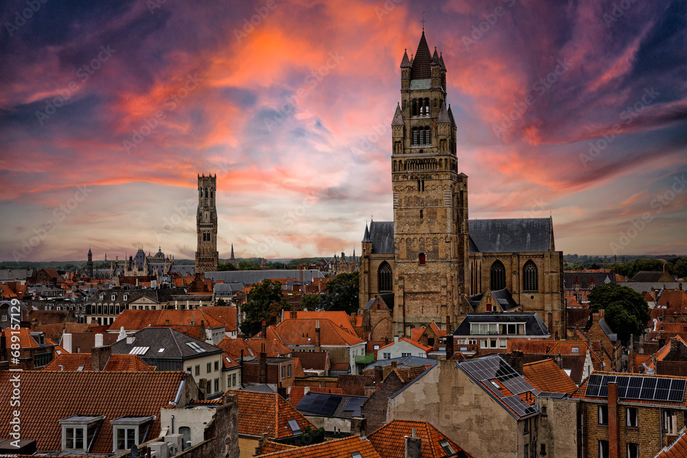 Naklejka premium Medieval Town Bruges old city in Flanders in Belgium Europe. Art and culture. Tourists from the world. Ancient medieval architecture gothic with towers buildings, canals, cobbled alleyways horses