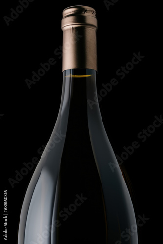 Bottle of red wine with blank white label isolated on black background photo