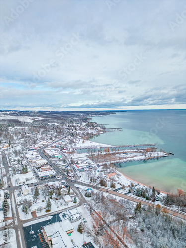 Winter's Serene Embrace: A Breathtaking Aerial View of Snow Covered Suttons Bay in Northern Michigan