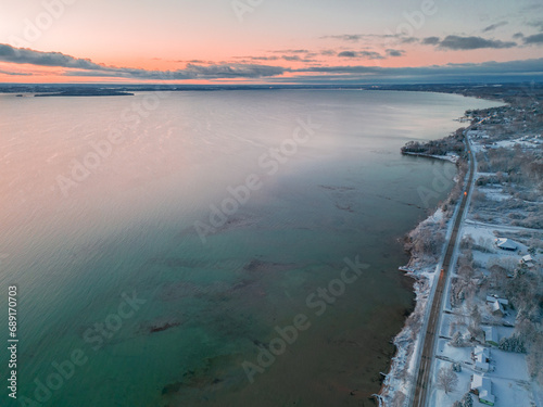 Winter's Serene Embrace: A Breathtaking Aerial View of Snow Covered Suttons Bay in Northern Michigan