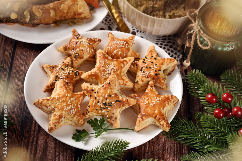 Star shaped puff pastry pies with mushroom filling for Christmas Eve supper top view