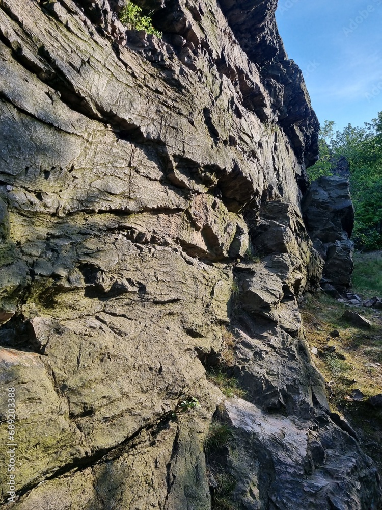powerful mountain in the Czech Republic, light falls on the rock, contrasting combination, Stone texture