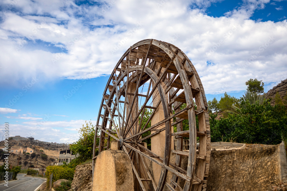 Vertical photograph of the Miguelico Núñez irrigation wheel in the Blanca orchard in the Ricote Valley, Murcia Vertical photograph of the Miguelico Núñez irrigation wheel in the Blanca orchard in the Ricote Valley, Murcia