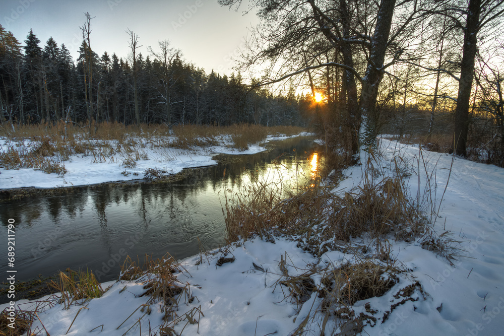 landscape winter trees and fields covered by snow in Poland, Europe on sunny day in winter, amazing clouds in blue sky , river valley landscape winter trees and fields covered by snow in Poland, Europe on sunny day in winter, amazing clouds in blue sky , river valley