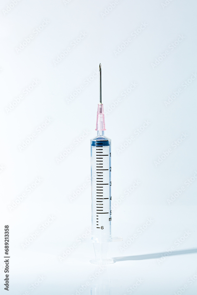 Macro syringe,A 5ml syringe and needle isolated on a white background with detailed clipping path,Close up of a syringe. Focus on numbers Macro syringe,A 5ml syringe and needle isolated on a white background with detailed clipping path,Close up of a syringe. Focus on numbers