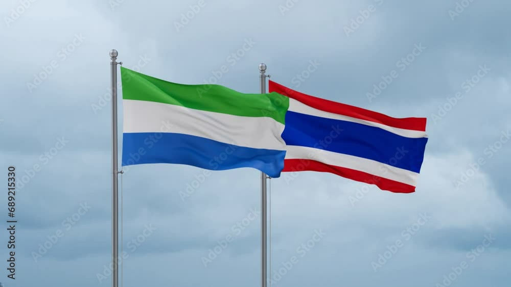 Kingdom of Thailand and Sierra Leone flag waving together on cloudy sky, endless seamless loop, two country cooperation concept Kingdom of Thailand and Sierra Leone flag waving together on cloudy sky, endless seamless loop, two country cooperation concept