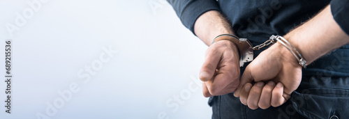 man hand handcuffs in back