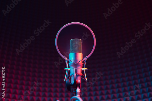 High-Quality Studio Recording Microphone with Neon Lighting on Gradient Backdrop photo