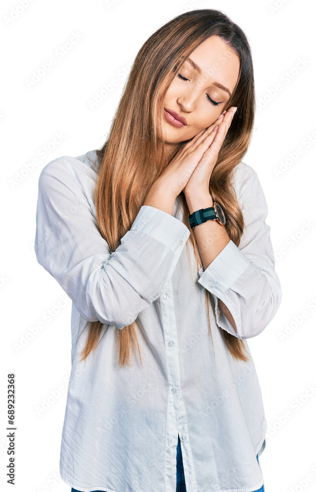 Beautiful caucasian woman wearing casual white shirt sleeping tired dreaming and posing with hands together while smiling with closed eyes. Beautiful caucasian woman wearing casual white shirt sleeping tired dreaming and posing with hands together while smiling with closed eyes.