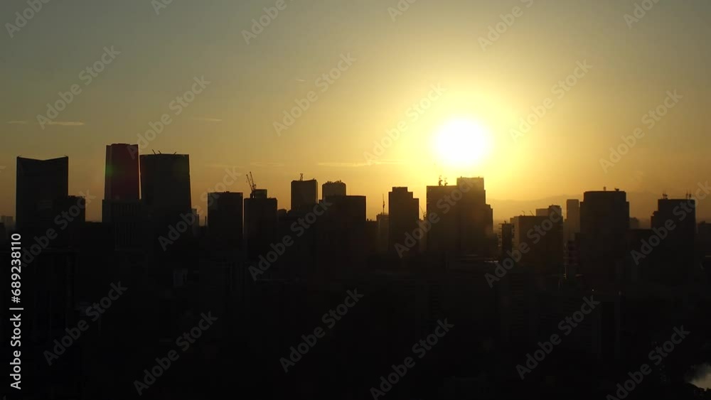 TOKYO, JAPAN - NOV 2023 : Aerial high angle view of cityscape of Tokyo and Mount Fuji in sunset. View of office buildings around Tokyo station and Nagatacho area. 4K time lapse shot, day to night. TOKYO, JAPAN - NOV 2023 : Aerial high angle view of cityscape of Tokyo and Mount Fuji in sunset. View of office buildings around Tokyo station and Nagatacho area. 4K time lapse shot, day to night.