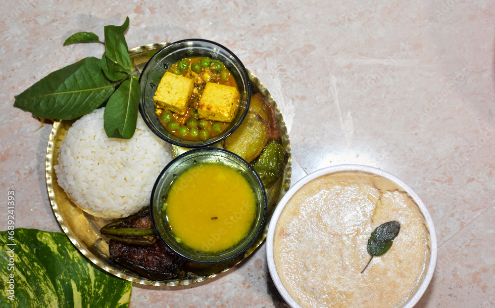 Indian Food thali. curd, Rice, Onions, Mixed vegetables, sweet, matar