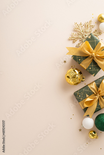 Extravagance and creative energy for New Year celebrations. Overhead vertical view of gifts adorned with ribbon, opulent decor, dazzling gold sequins against soft beige backdrop, space for personal ad