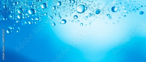 Fresh crystal-clear blue water bubbles abstract horizontal wallpaper wellnes  refreshment and cosmetics concept  copy space for text