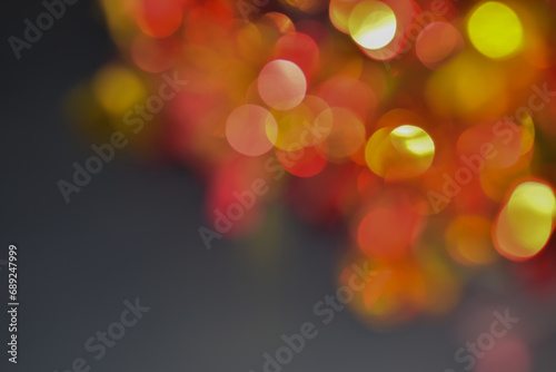 Christmas lights with ornaments in blue lights and bokeh - Real fir branches with glitter in an abstract blurry background - This image has 3D rendering elements.