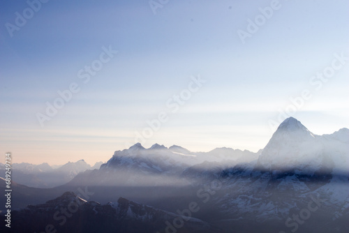 landscape of mountains with snow in the dusty morning and clear sky