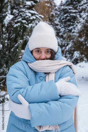 portrait of the woman get frozen outdoors at cold winter day