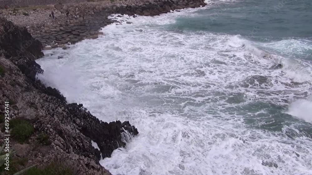 Waves crashing on the harbor's breakwater. Waves crashing on the harbor's breakwater.