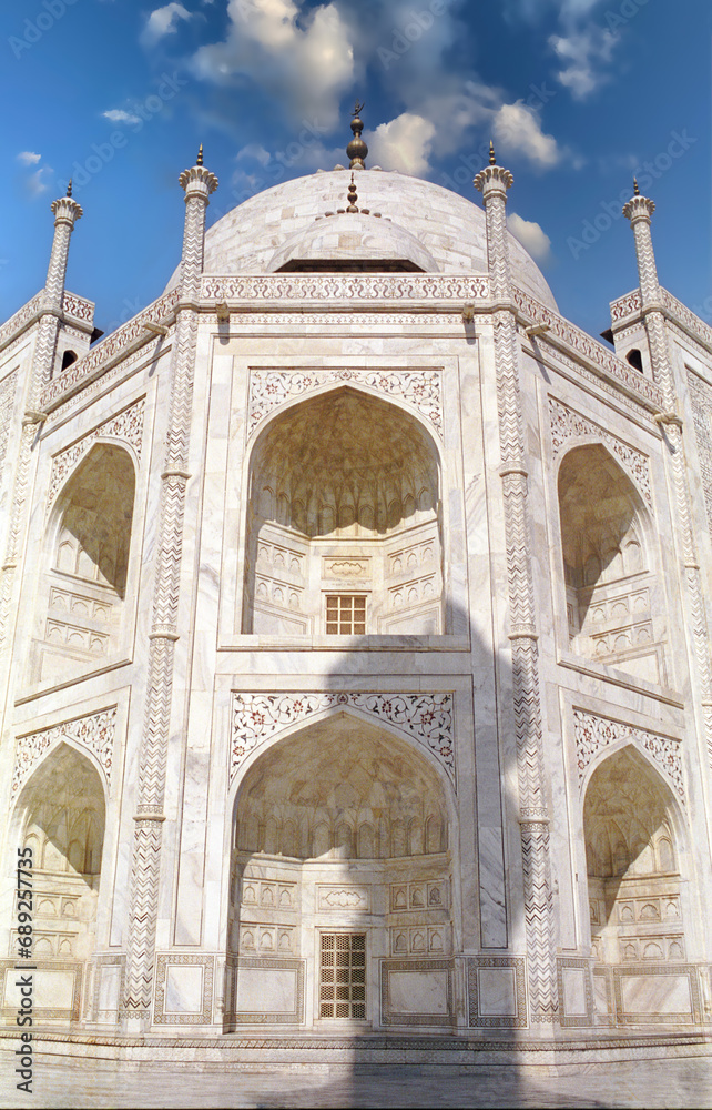  Agra, India - A side of the Taj Mahal a world wonder with its artful symmetrical arched openings. 