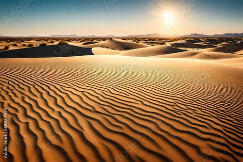 A Broad perspective of a large desert with undulating sand dunes, a brilliant blue sky, and lengthy shadows produced by the sun