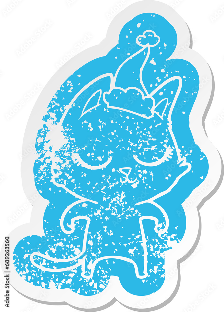 calm quirky cartoon distressed sticker of a cat wearing santa hat