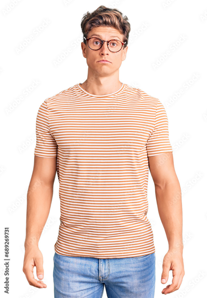 Young handsome man wearing casual clothes and glasses depressed and worry for distress, crying angry and afraid. sad expression. Young handsome man wearing casual clothes and glasses depressed and worry for distress, crying angry and afraid. sad expression.