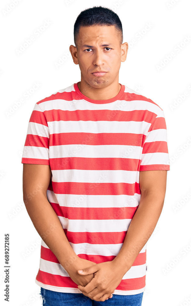Young handsome latin man wearing casual clothes depressed and worry for distress, crying angry and afraid. sad expression. Young handsome latin man wearing casual clothes depressed and worry for distress, crying angry and afraid. sad expression.