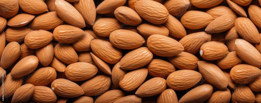 Background from peeled almonds. Almond background for design. Background from peeled almonds. Almond background for design.