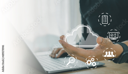 Cloud technology. Data storage. Networking and internet service concept. User use Laptop with cloud computing diagram show on hand.
