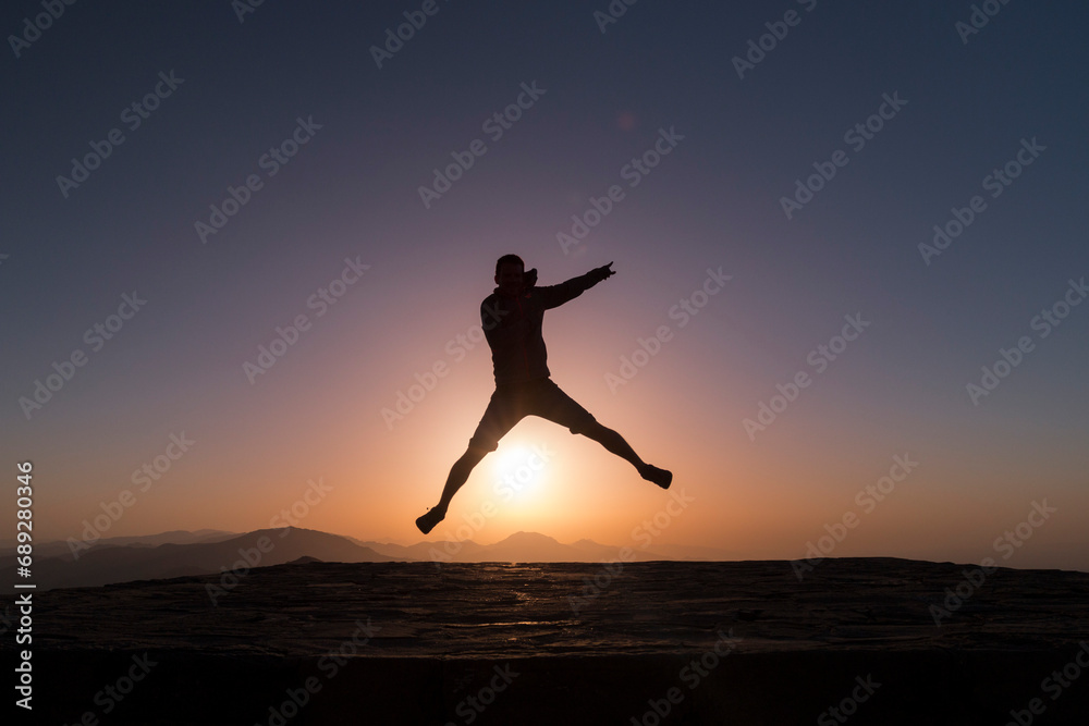 star jumping over the sun, man silhuette at sunrise, Nemrut, Turkey