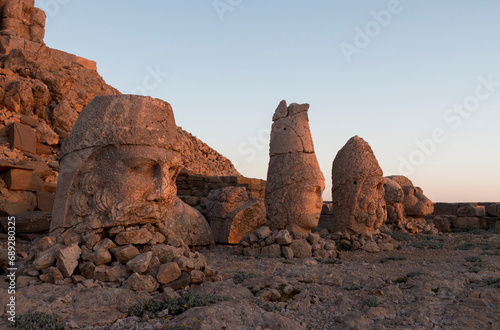 heads of statues at sunrise, Herekles, Apollo & Zeus, East Terrace, Mount Nemrut, Turkey
