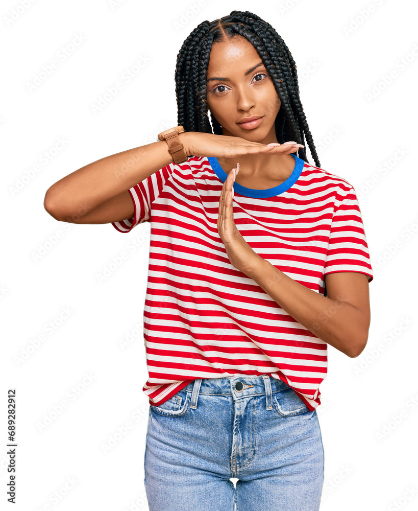 Beautiful hispanic woman wearing casual clothes doing time out gesture with hands, frustrated and serious face Beautiful hispanic woman wearing casual clothes doing time out gesture with hands, frustrated and serious face