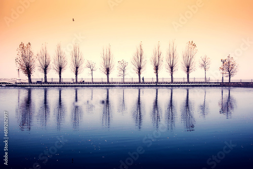 Obraz na płótnie Mystical spooky depressing autumn landscape with a lonely silhouette of a passerby on a background of fog over the lake. (Autumn depression, sadness, psychotherapy - concept) w salonie