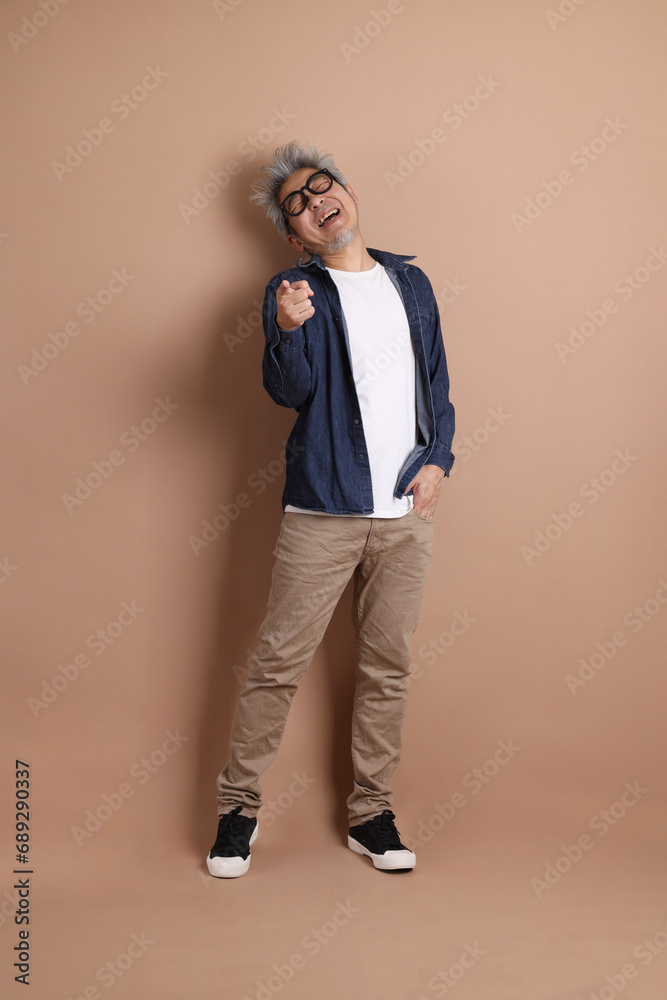 Fototapeta premium Asian energetic senior man