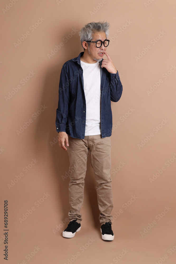 Fototapeta premium Asian energetic senior man