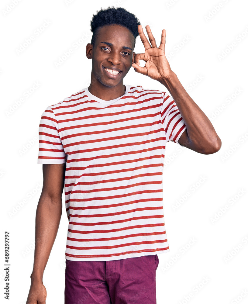 Young african american man wearing casual clothes smiling positive doing ok sign with hand and fingers. successful expression. Young african american man wearing casual clothes smiling positive doing ok sign with hand and fingers. successful expression.