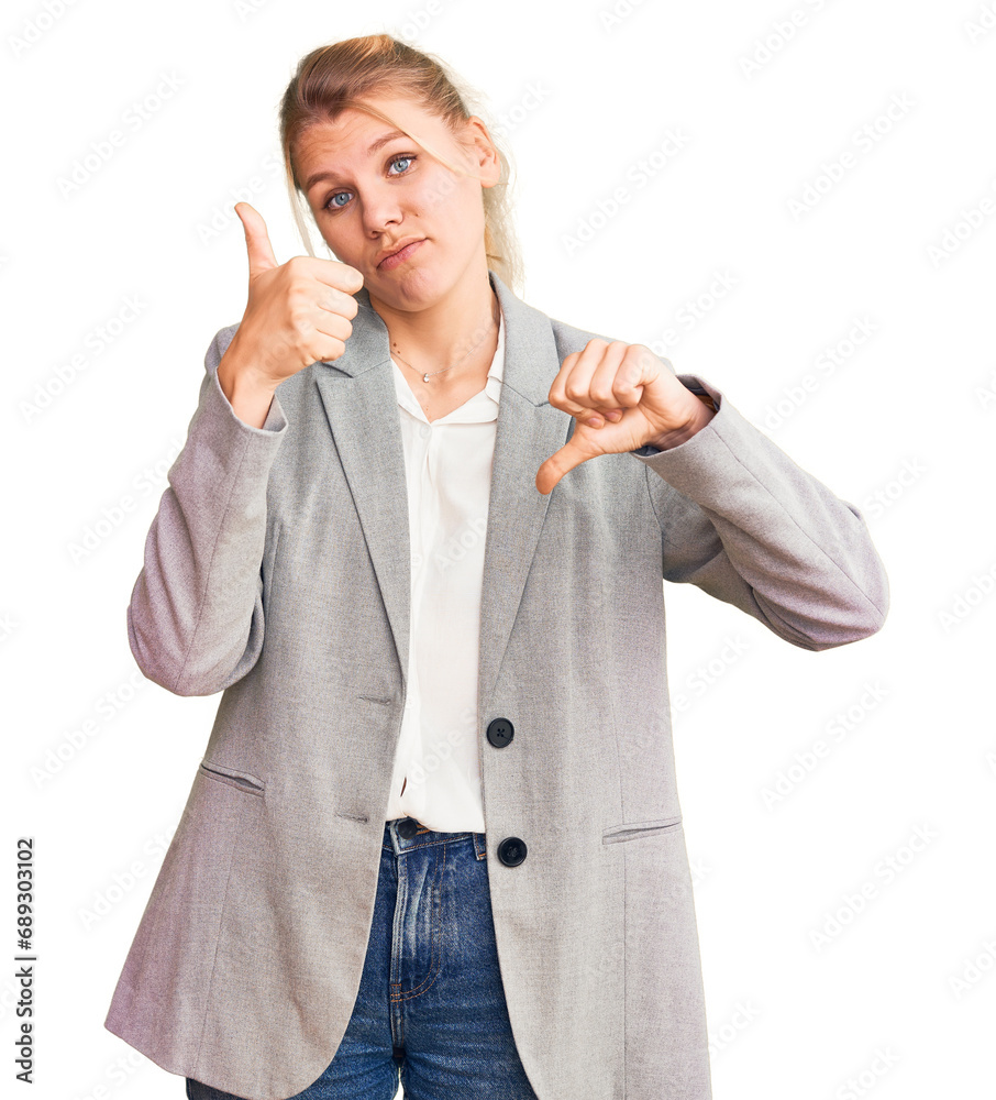 Young beautiful blonde woman wearing elegant jacket doing thumbs up and down, disagreement and agreement expression. crazy conflict