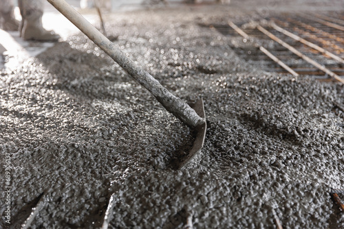 Construction site of buildings pouring cement. Top view new screed concrete with leveling mortar for floors photo