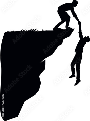 A man holds another man's hand, preventing him from falling off the cliff. 