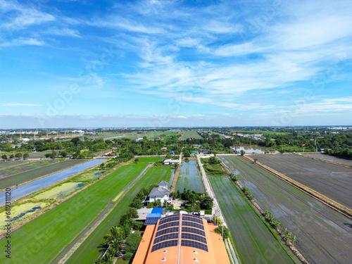 Canvas Print Aerial view the landscape greenfield of a lot of agriculture fields with solar roof top at warehouse