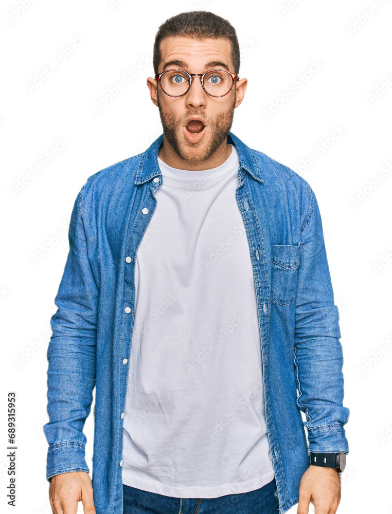 Young caucasian man wearing casual clothes afraid and shocked with surprise and amazed expression, fear and excited face. Young caucasian man wearing casual clothes afraid and shocked with surprise and amazed expression, fear and excited face.