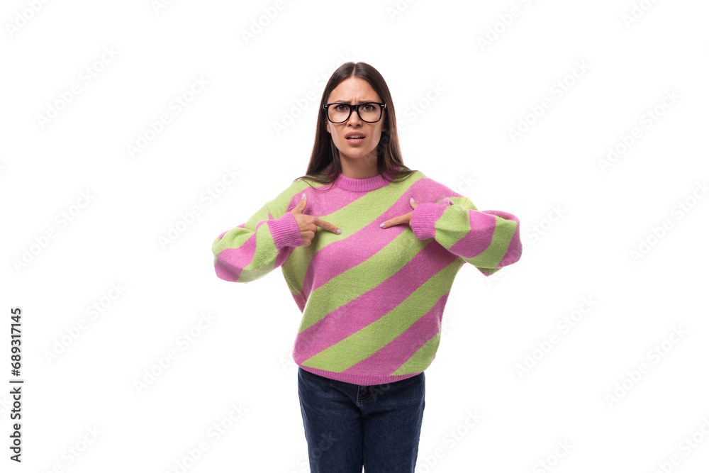 pretty 35 year old feminine model woman dressed in a striped pink-green sweater on a white background pretty 35 year old feminine model woman dressed in a striped pink-green sweater on a white background