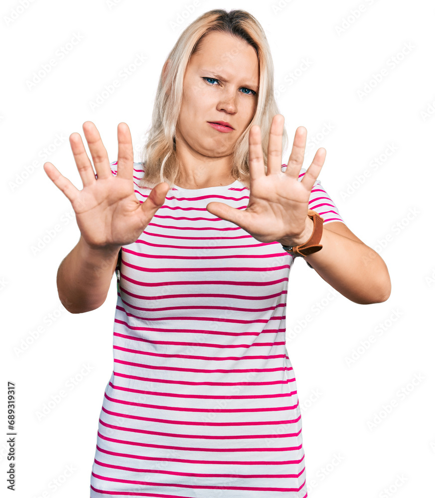 Young caucasian woman wearing casual clothes doing stop gesture with hands palms, angry and frustration expression Young caucasian woman wearing casual clothes doing stop gesture with hands palms, angry and frustration expression