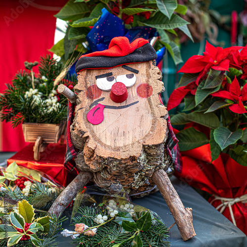 Caga Tio de Nadal, a typical Christmas toy in Catalonia, Spain. Traditional character on a Christmas market. photo