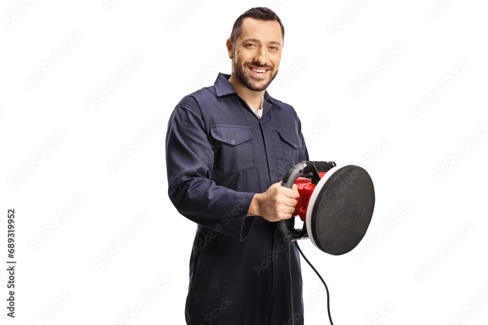 Car service worker holding a polishing machine Car service worker holding a polishing machine
